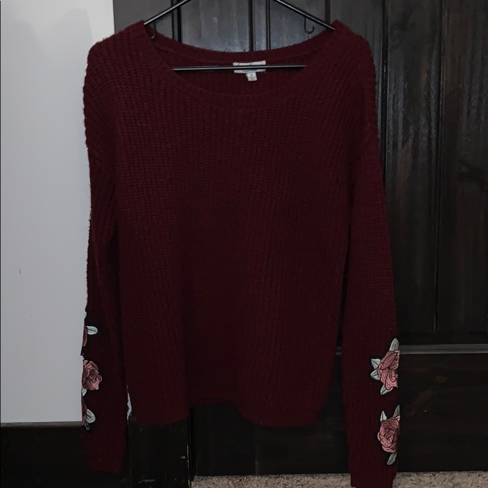 Super cute maroon sweater with floral prints!